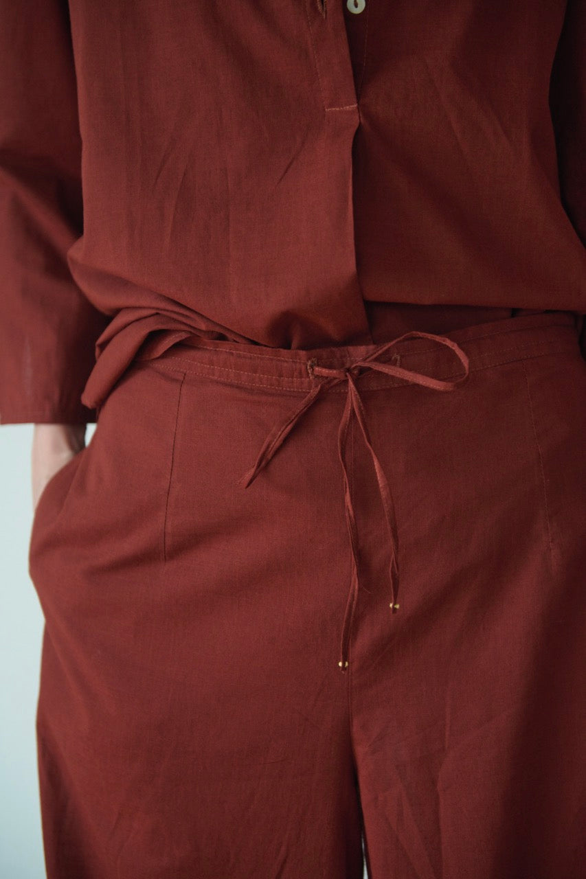 casual cotton setup with wide hem pants and kurta style top with embrpidery detail at the back in a deep toasted brown colour