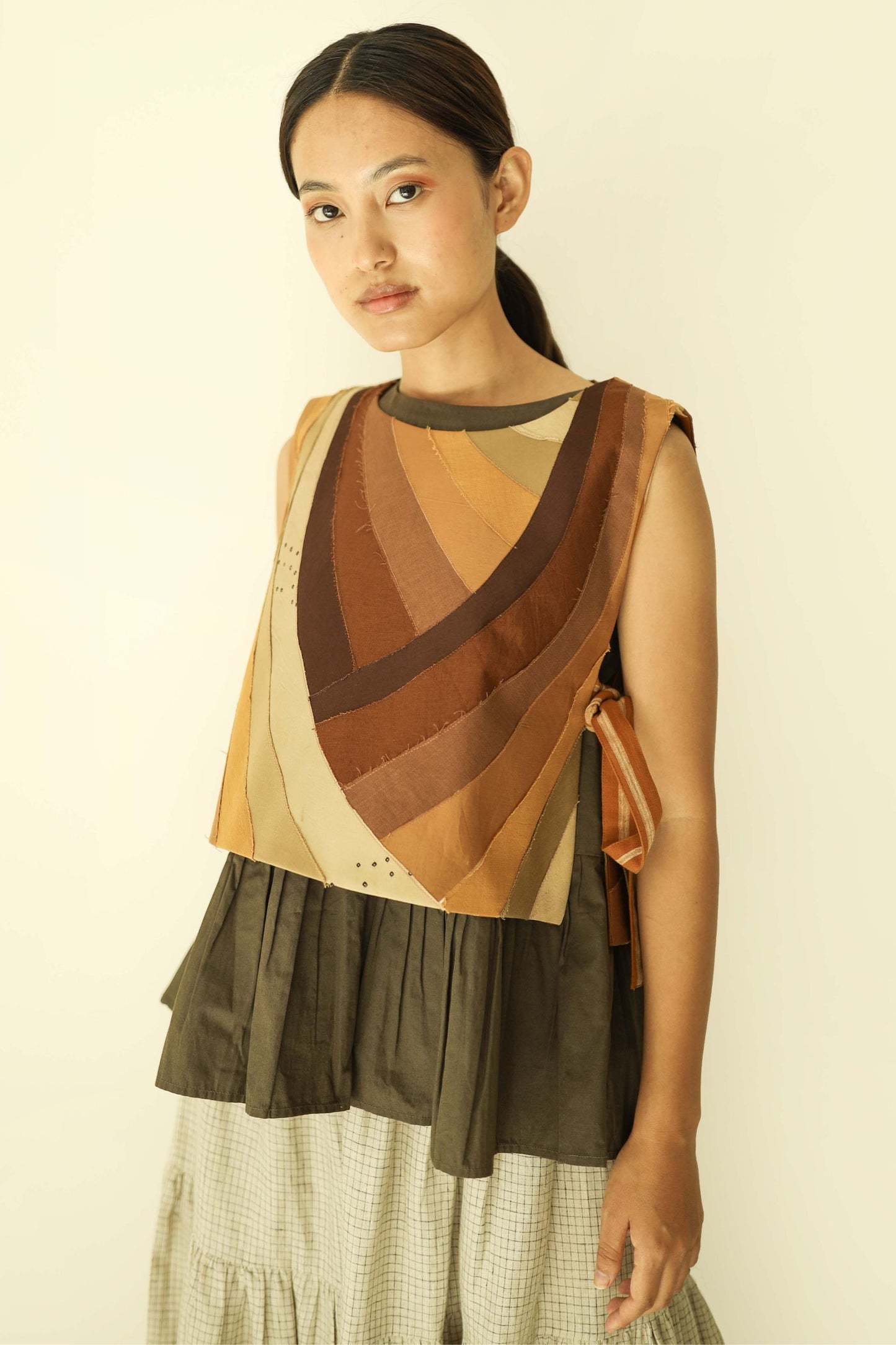 one of a kind patchwork bib style vest. Available in Japan.