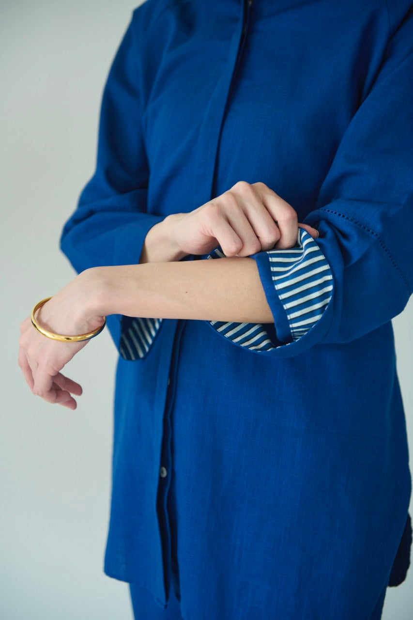 A setup made with blue cotton with collared shirt and half elasticated pants in a deep shade of blue