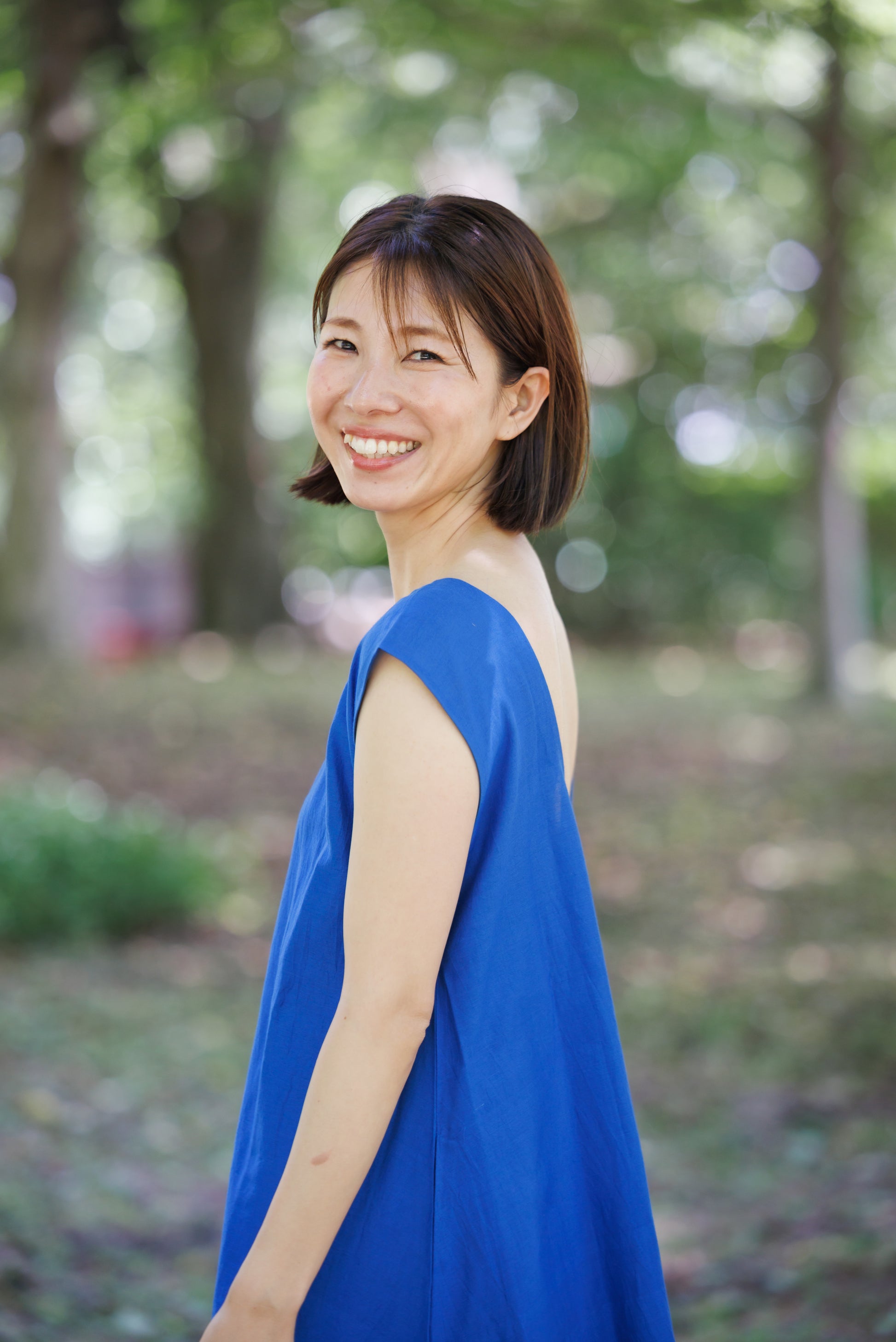 bright blue shift dress with tier hem and scoop back
