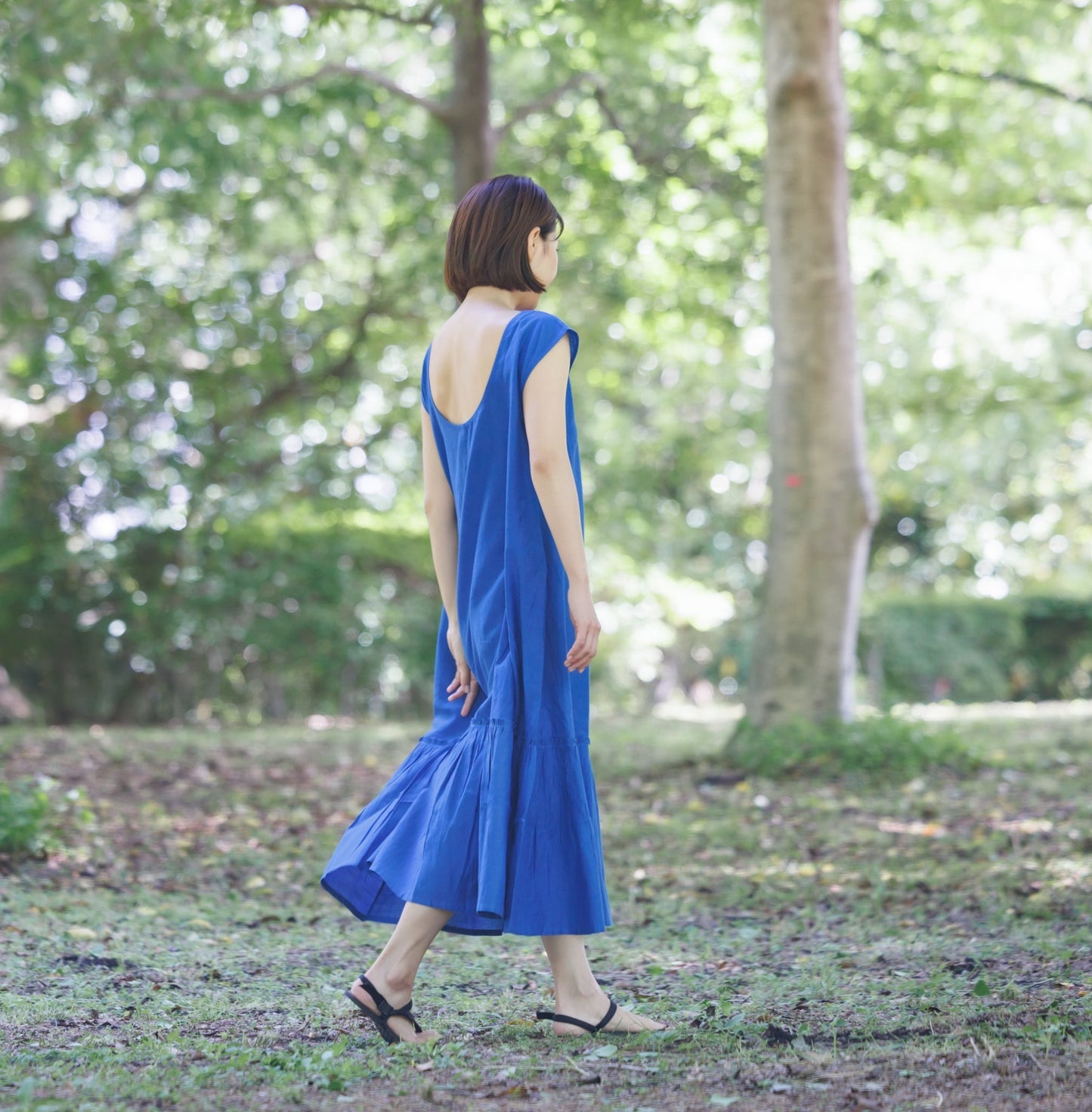 bright blue shift dress with tier hem and scoop back