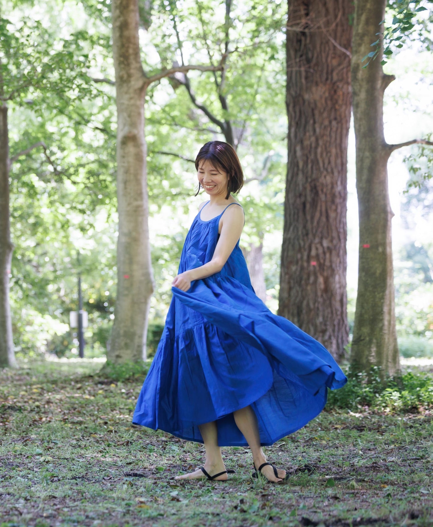 Blue three tier dress with comfortable straps and a very large fllare. 