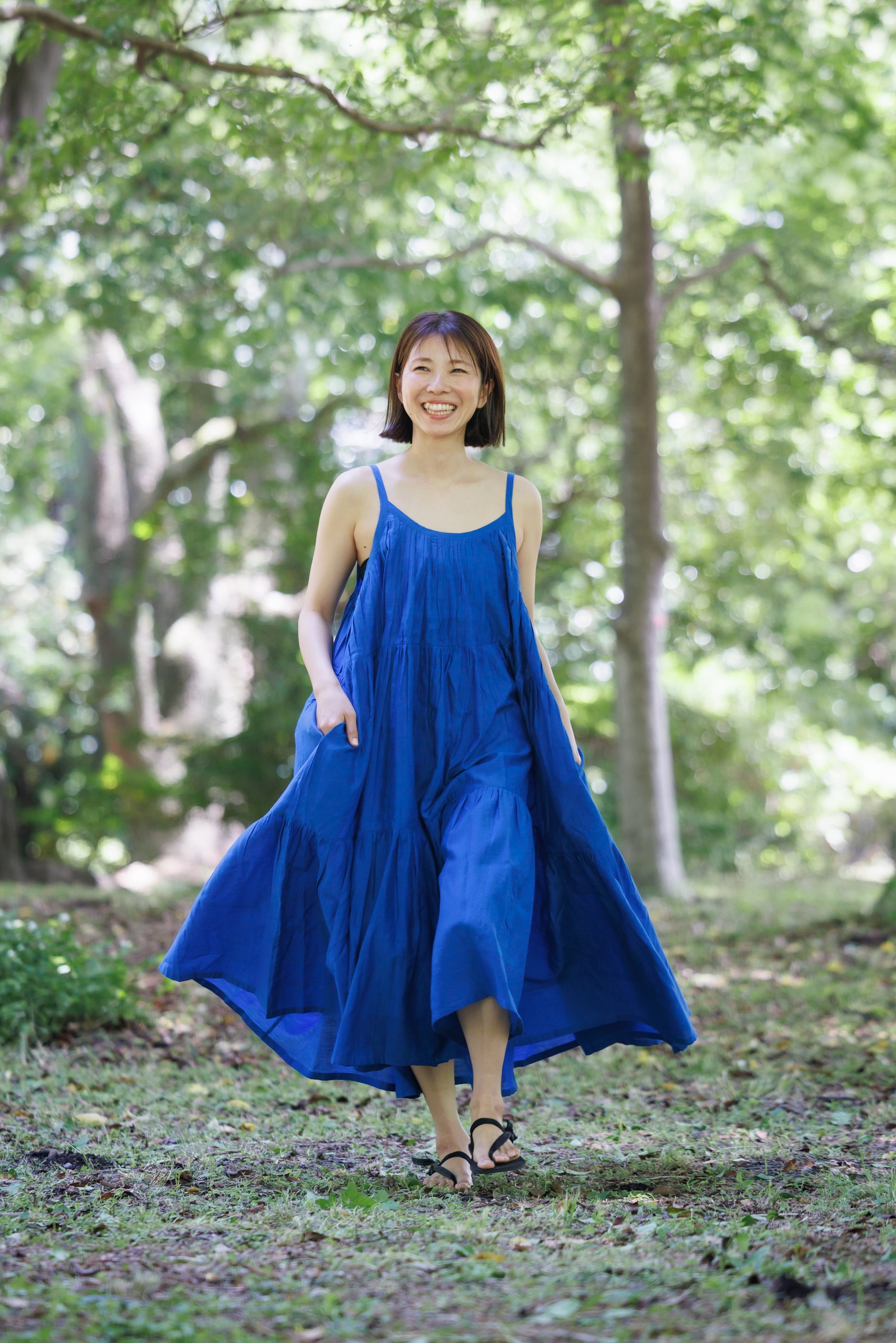 Blue three tier dress with comfortable straps and a very large fllare. 