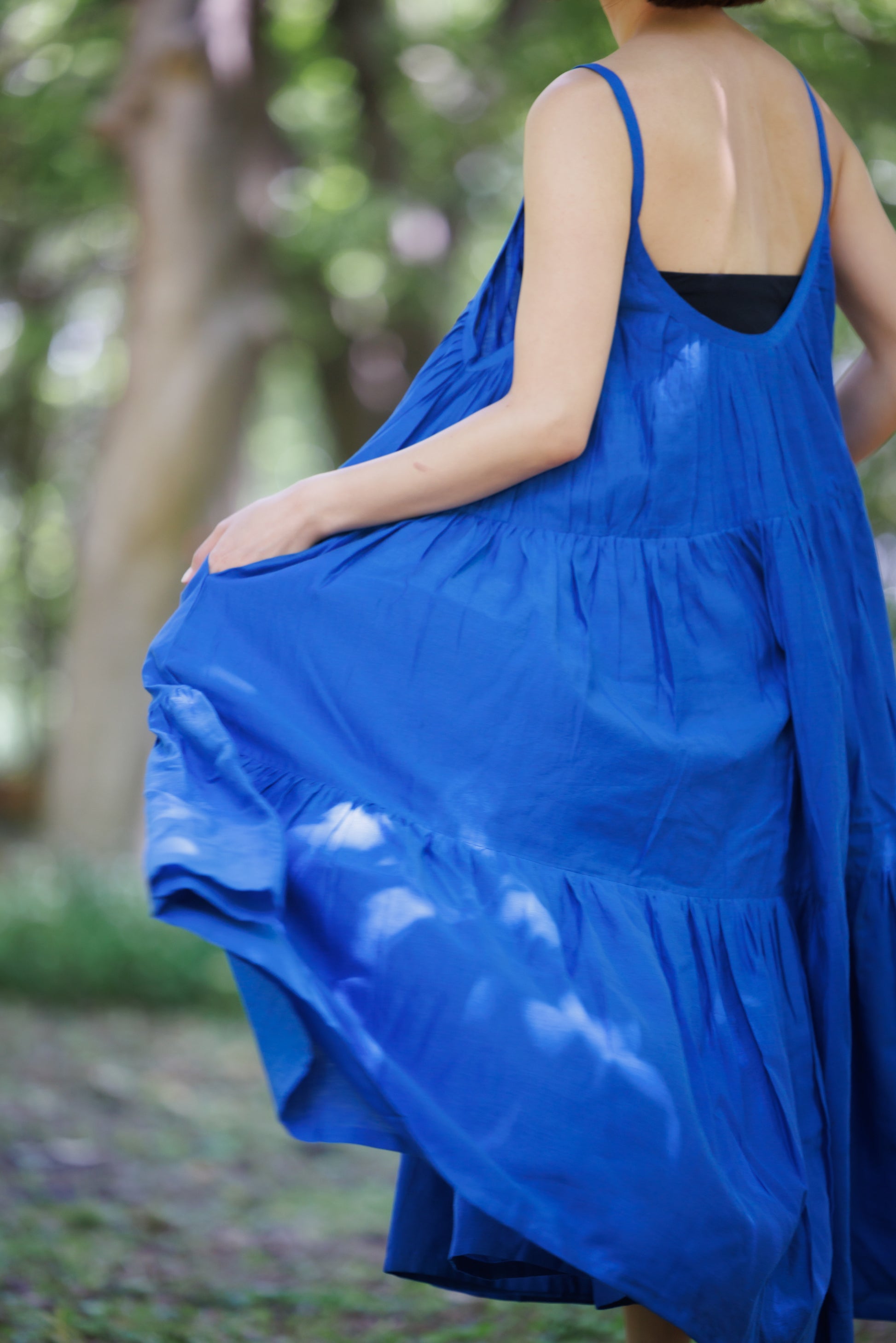 Blue three tier dress with comfortable straps and a very large fllare. 