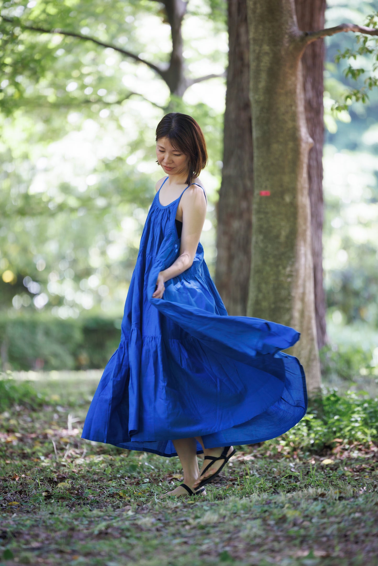 Blue three tier dress with comfortable straps and a very large fllare. 