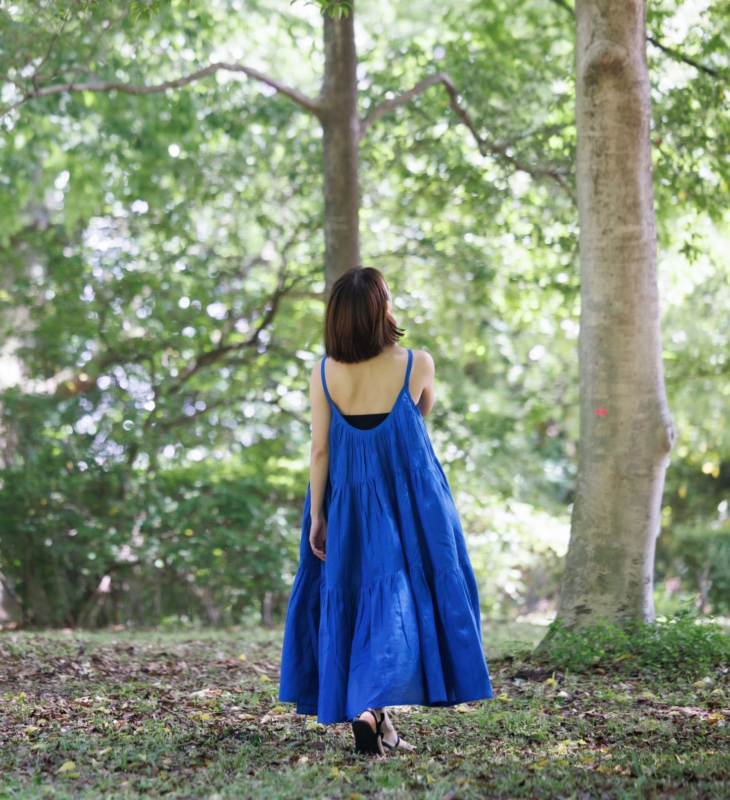 Blue three tier dress with comfortable straps and a very large fllare. 