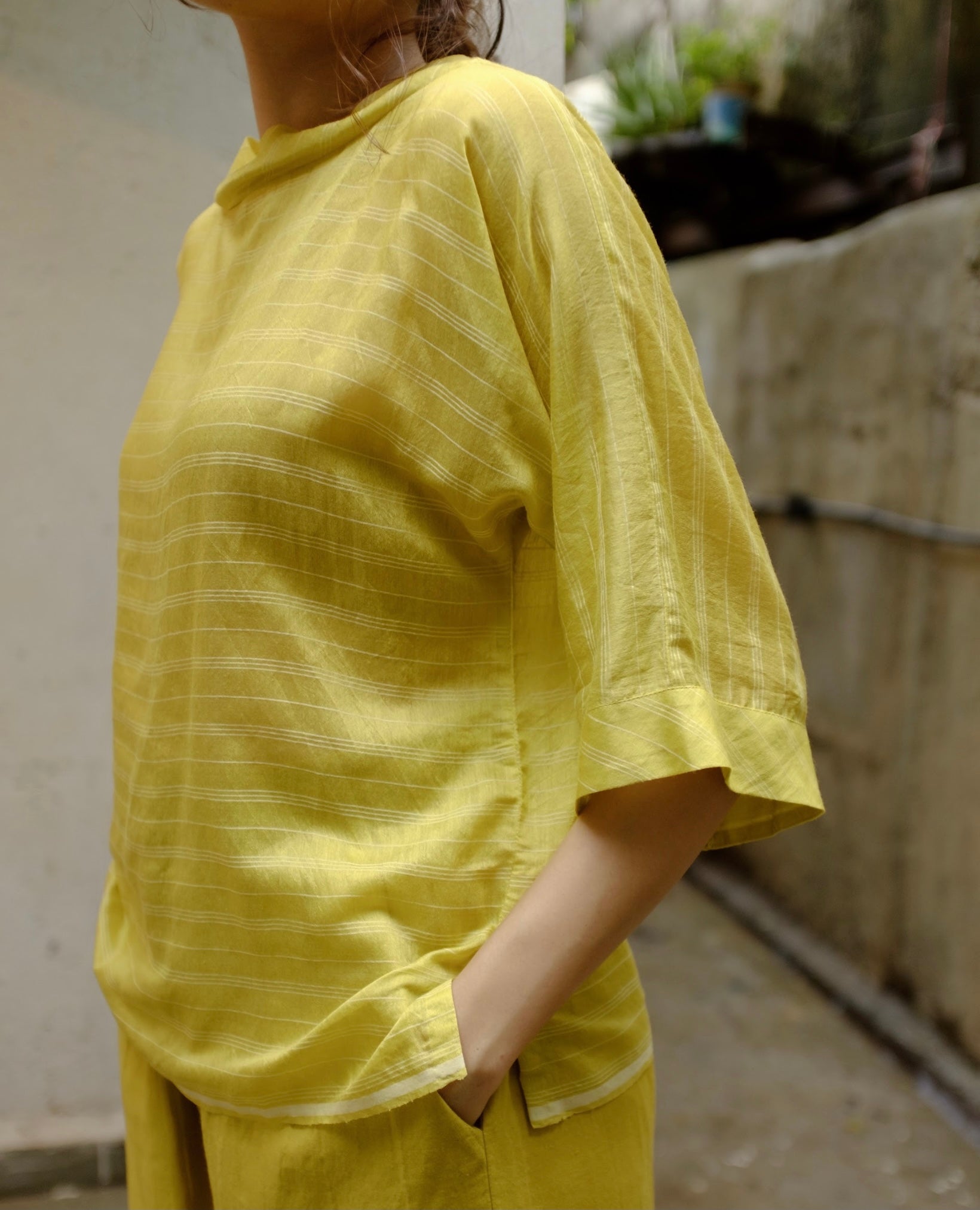 golden yellow striped handwoven modal silk box fit top for women. Available in Japan.