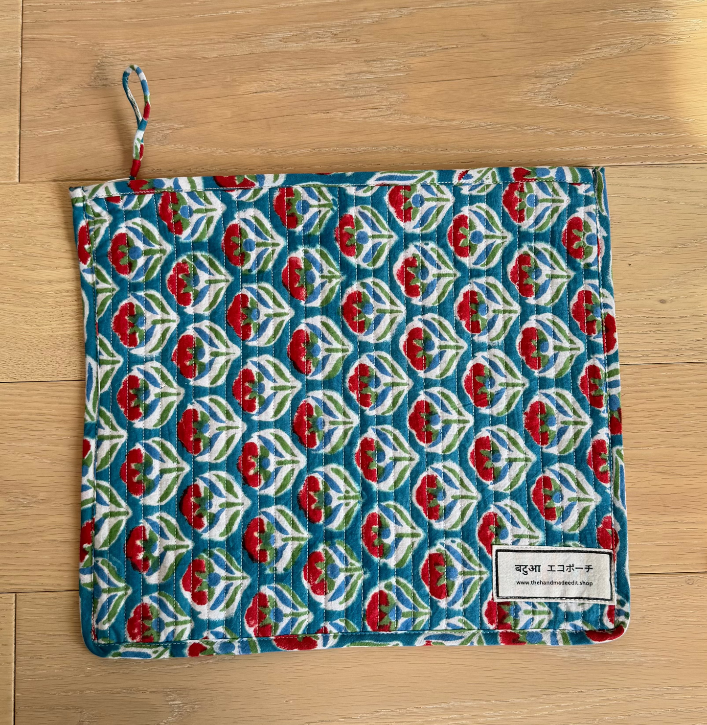 Patterned pouch on a wooden surface