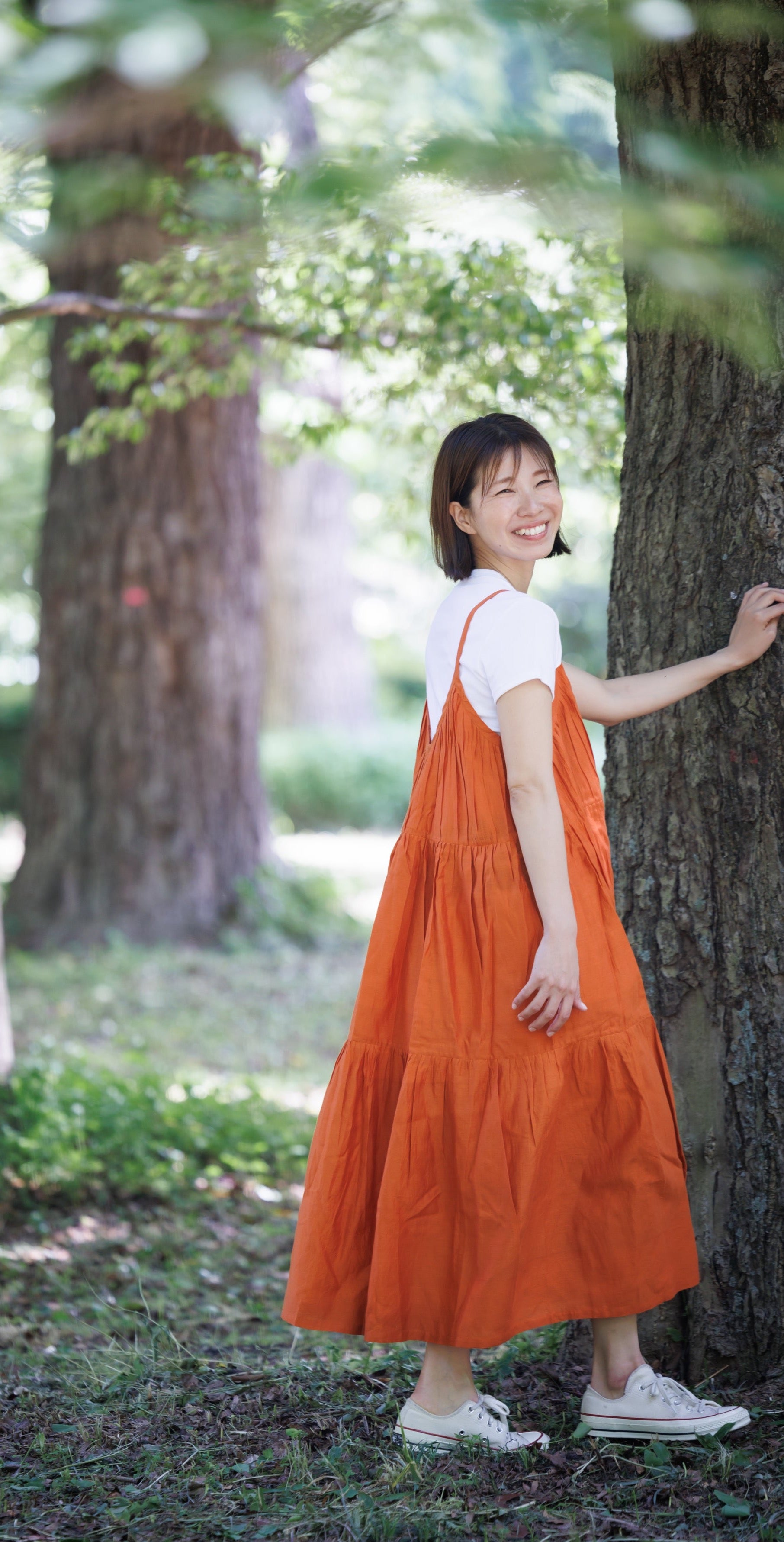 Orange three tier strappy dress with scoop back and large flare