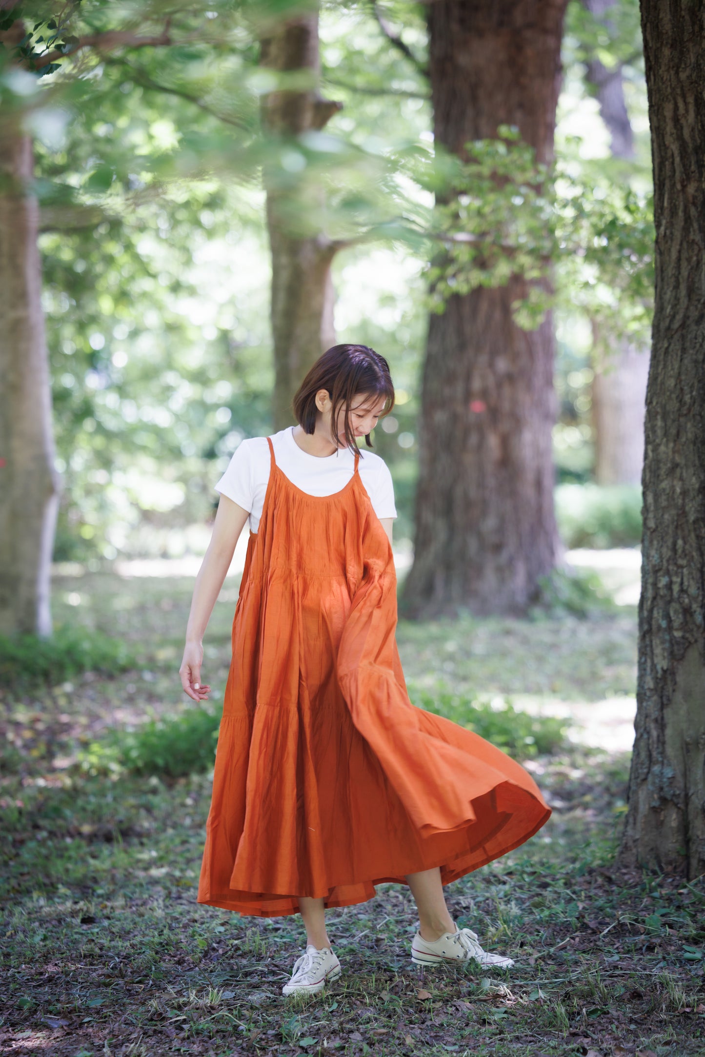 Orange three tier strappy dress with scoop back and large flare