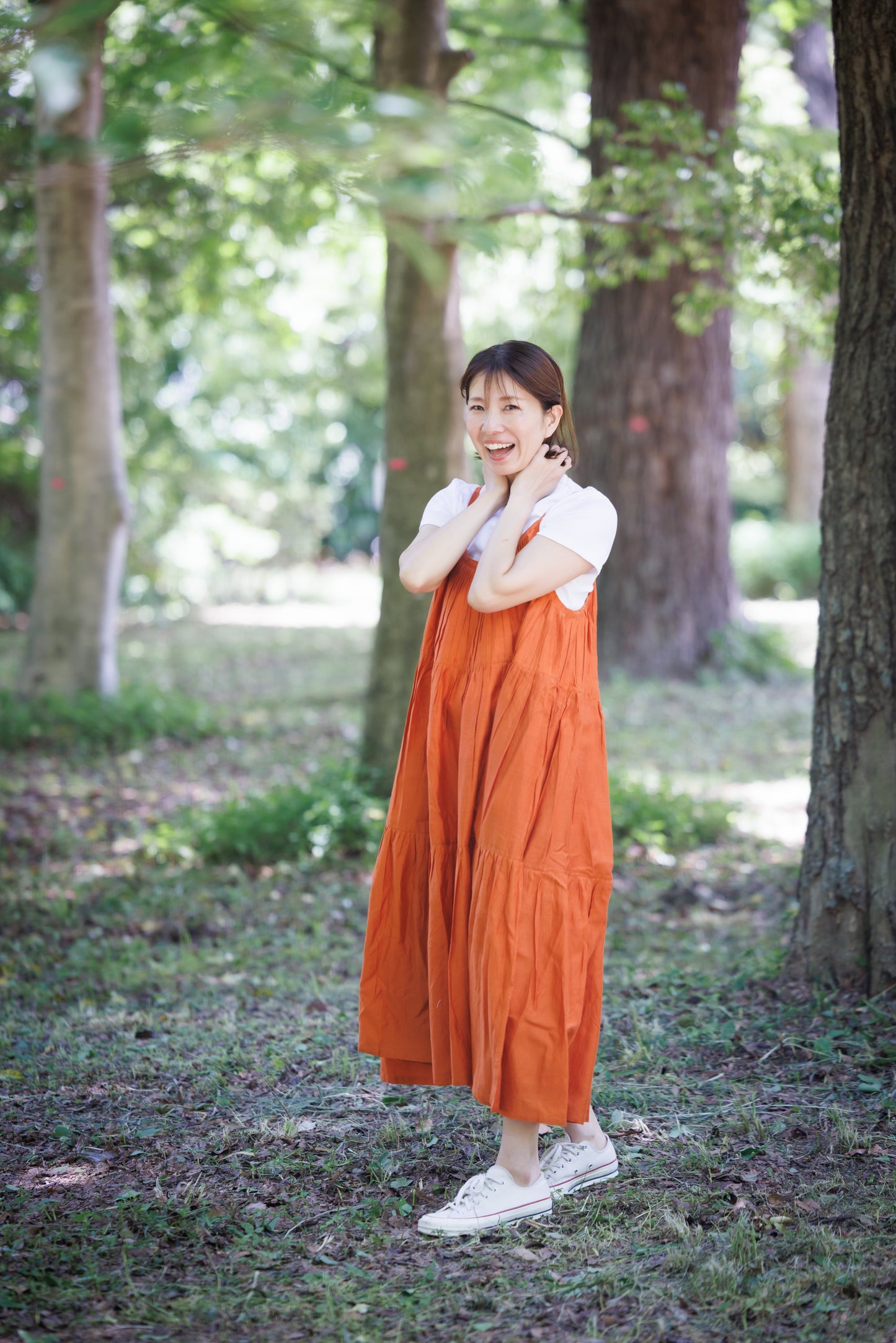 Orange three tier strappy dress with scoop back and large flare