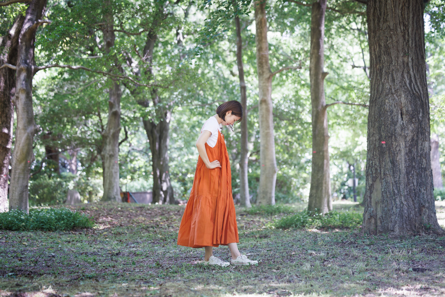 Orange three tier strappy dress with scoop back and large flare