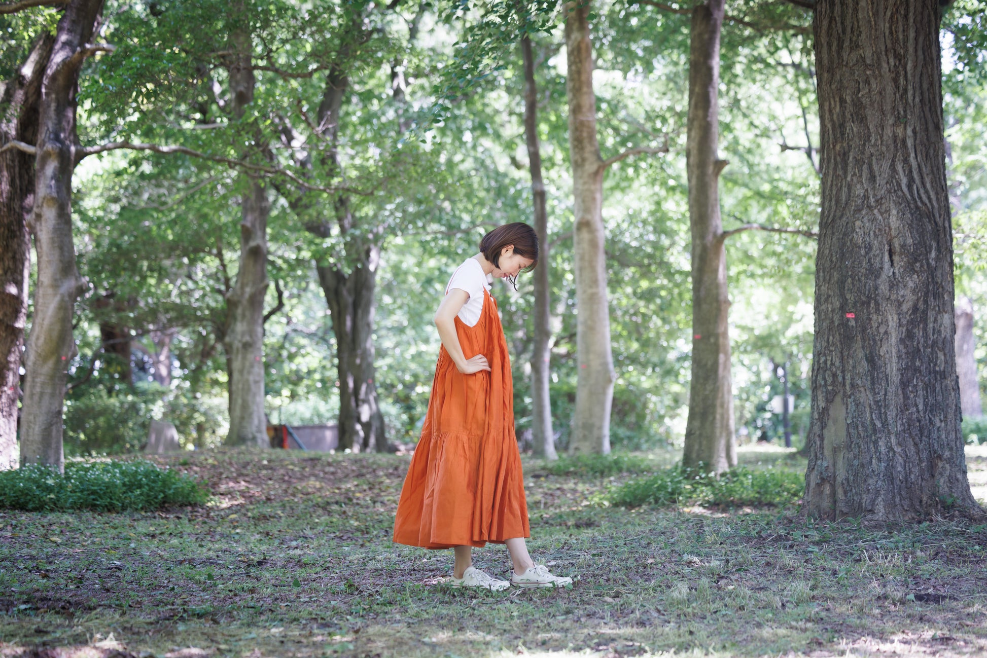 Orange three tier strappy dress with scoop back and large flare