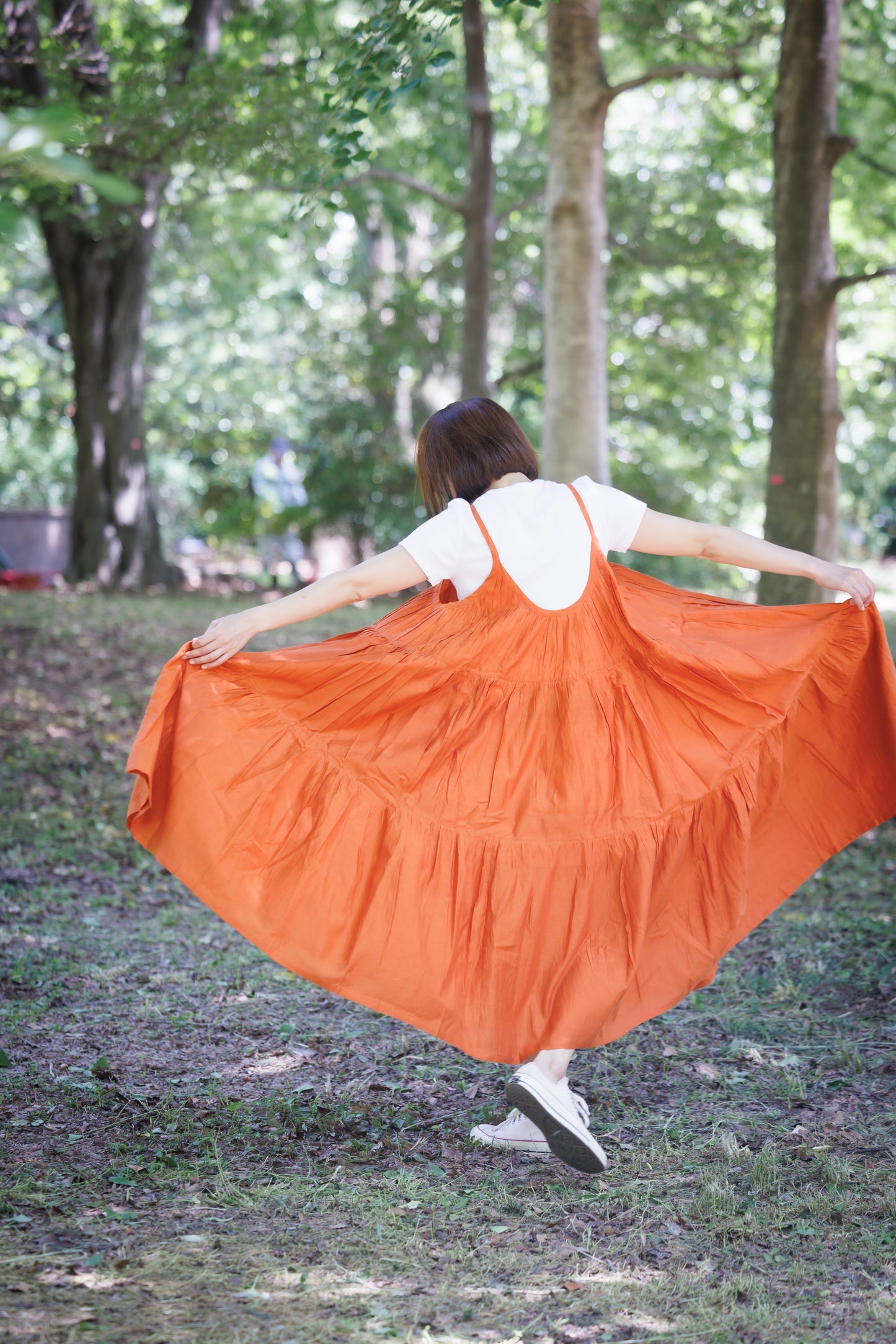Orange three tier strappy dress with scoop back and large flare