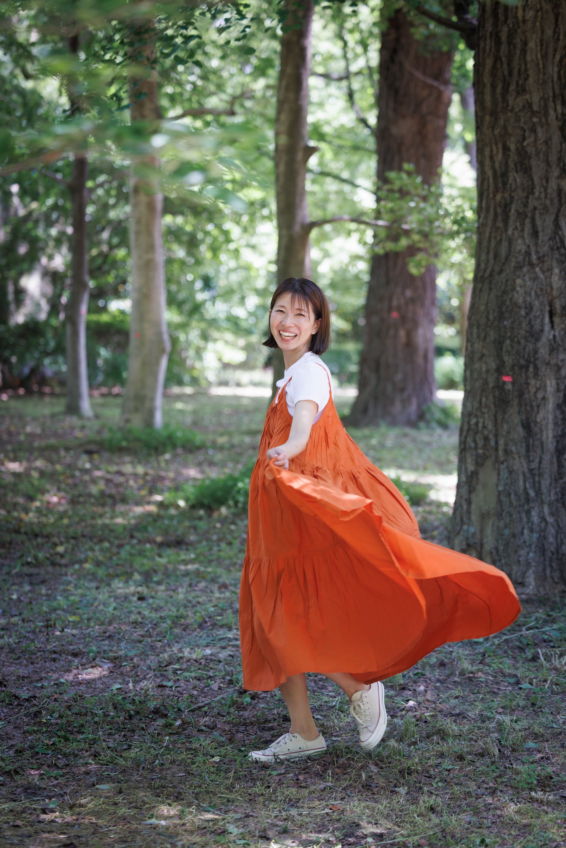 Orange three tier strappy dress with scoop back and large flare
