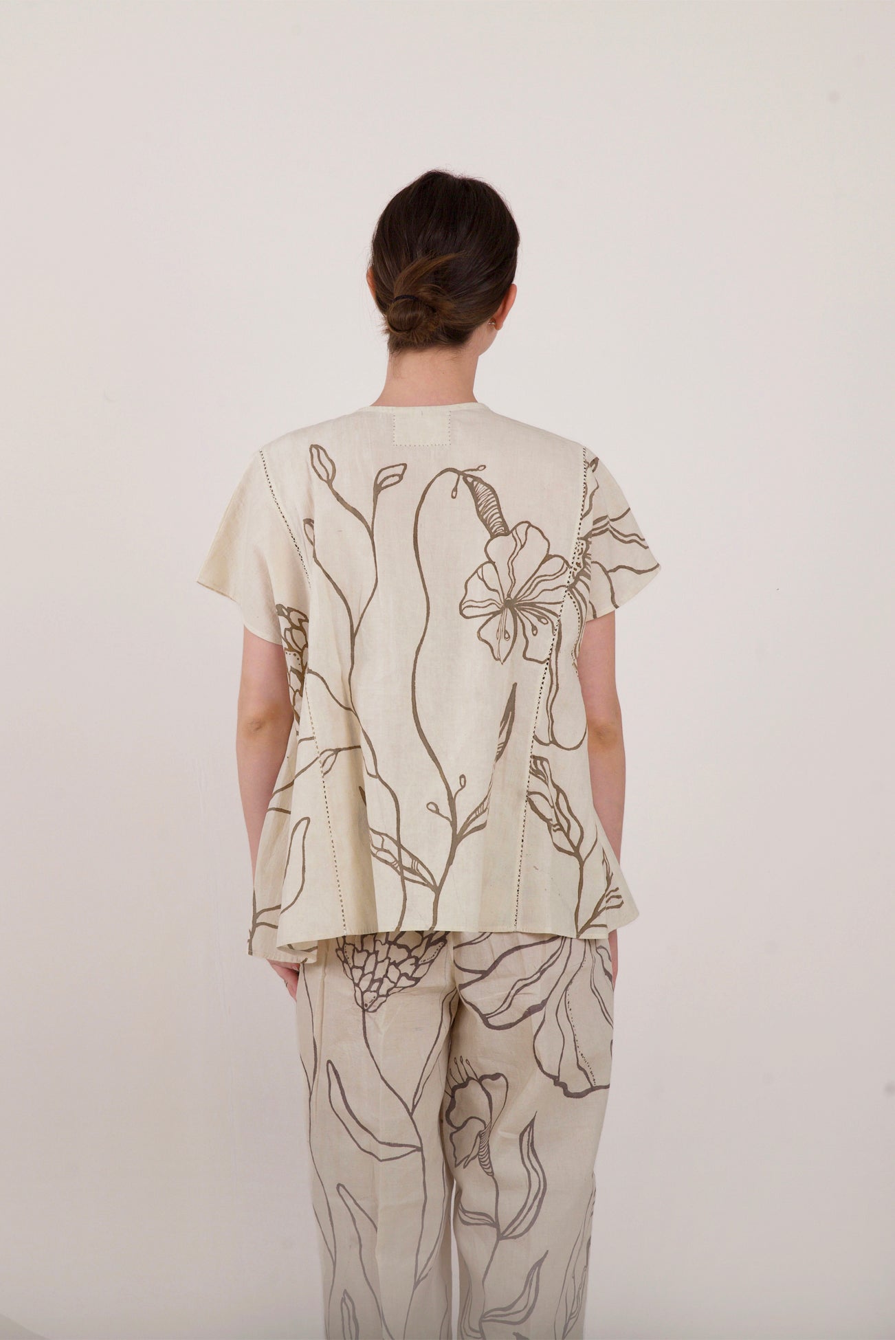 Floral flare hand painted off-white cotton top